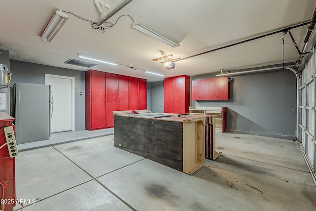 1391 W Windhaven Ave, Gilbert, AZ 85233 - garage with freestanding refrigerator and a garage door opener