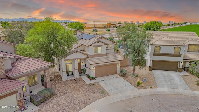 2016 S 102nd Ln, Tolleson, AZ 85353 - view of front facade with an attached garage, concrete driveway, and stucco siding
