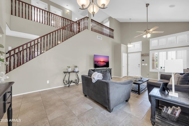 2016 S 102nd Ln, Tolleson, AZ 85353 - living room featuring high vaulted ceiling, ceiling fan, baseboards, stairs, and a chandelier