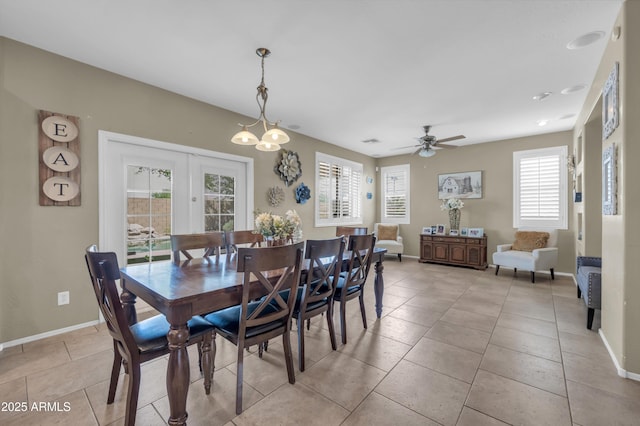 2016 S 102nd Ln, Tolleson, AZ 85353 - dining area with light tile patterned floors, baseboards, french doors, and ceiling fan