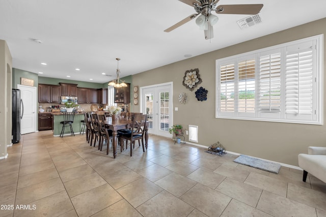 2016 S 102nd Ln, Tolleson, AZ 85353 - dining room featuring ceiling fan, light tile patterned flooring, baseboards, and recessed lighting
