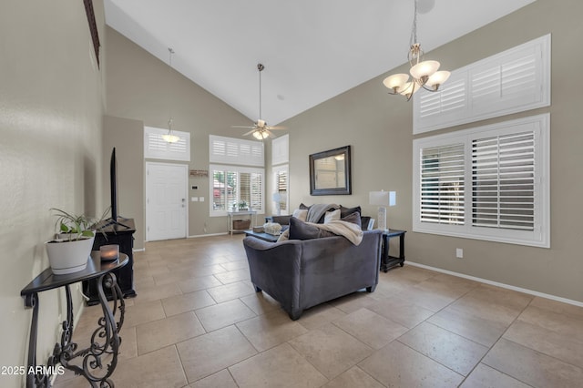 2016 S 102nd Ln, Tolleson, AZ 85353 - living room featuring high vaulted ceiling, baseboards, a ceiling fan, a chandelier, and light tile patterned flooring