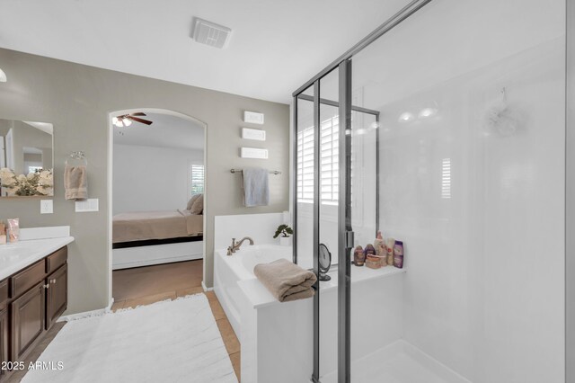 2016 S 102nd Ln, Tolleson, AZ 85353 - bathroom featuring vanity, a shower stall, plenty of natural light, and connected bathroom