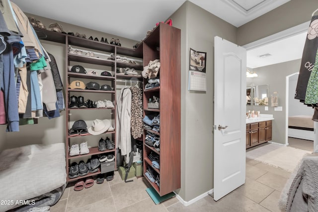 2016 S 102nd Ln, Tolleson, AZ 85353 - spacious closet with light tile patterned flooring and a sink