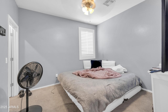 2016 S 102nd Ln, Tolleson, AZ 85353 - carpeted bedroom with baseboards and a ceiling fan