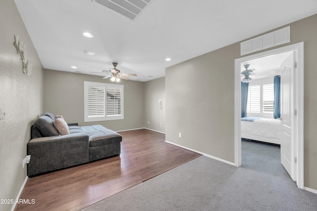 2016 S 102nd Ln, Tolleson, AZ 85353 - living area featuring ceiling fan, baseboards, recessed lighting, and wood finished floors