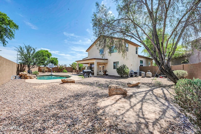 2016 S 102nd Ln, Tolleson, AZ 85353 - rear view of property featuring stucco siding, a fenced backyard, and a patio area