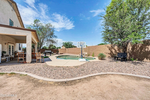 2016 S 102nd Ln, Tolleson, AZ 85353 - view of swimming pool featuring a patio, a fenced backyard, and french doors