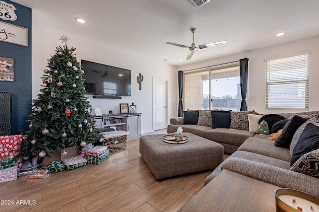 living room with hardwood / wood-style floors and ceiling fan