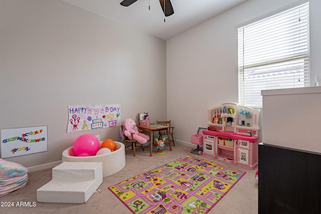 game room with vaulted ceiling, ceiling fan, and carpet flooring