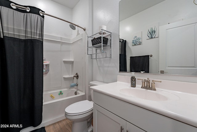 full bathroom with vanity, toilet, hardwood / wood-style floors, and shower / bath combo