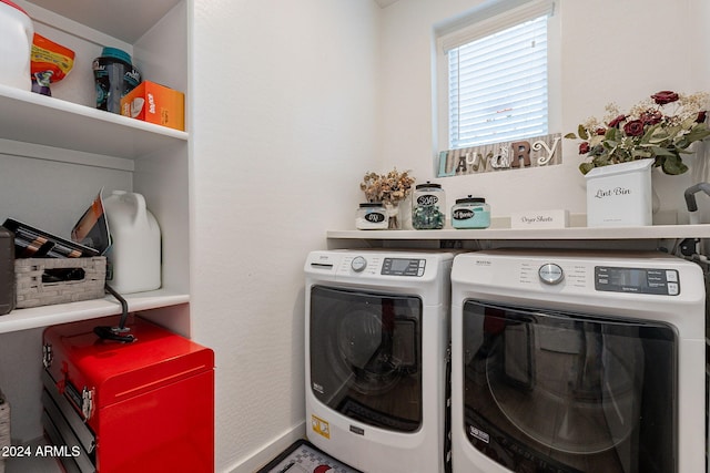 washroom featuring washing machine and dryer