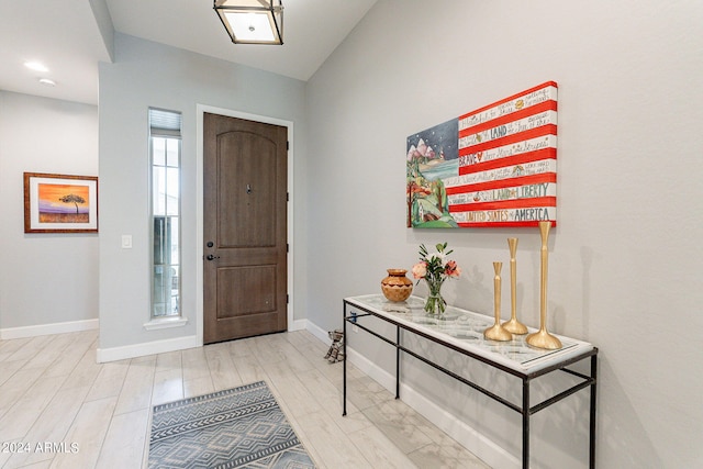 foyer entrance with light hardwood / wood-style flooring