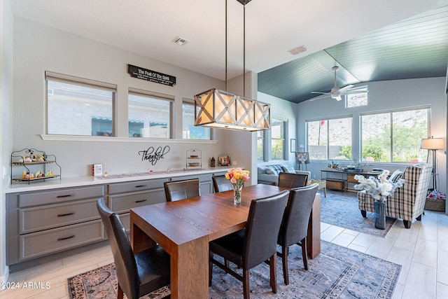 dining room with vaulted ceiling and ceiling fan