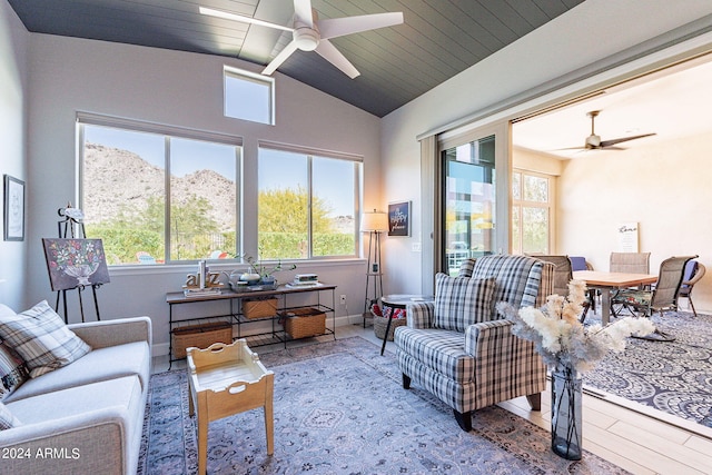 living room with ceiling fan and hardwood / wood-style floors