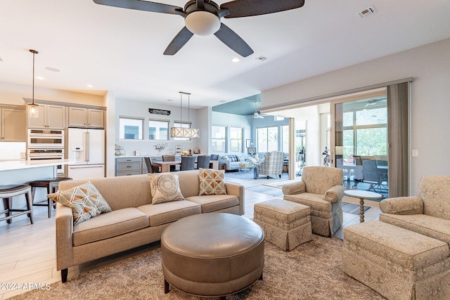 living room with tile flooring and ceiling fan