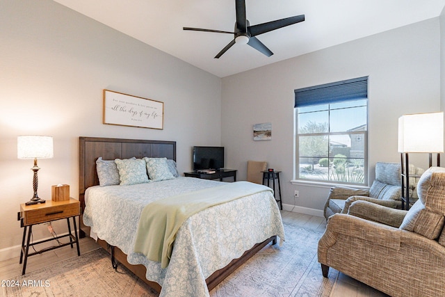 bedroom featuring ceiling fan and wood-type flooring