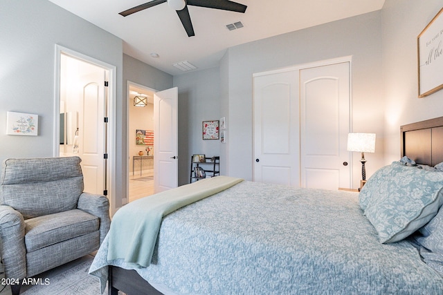 bedroom featuring hardwood / wood-style flooring, a closet, and ceiling fan