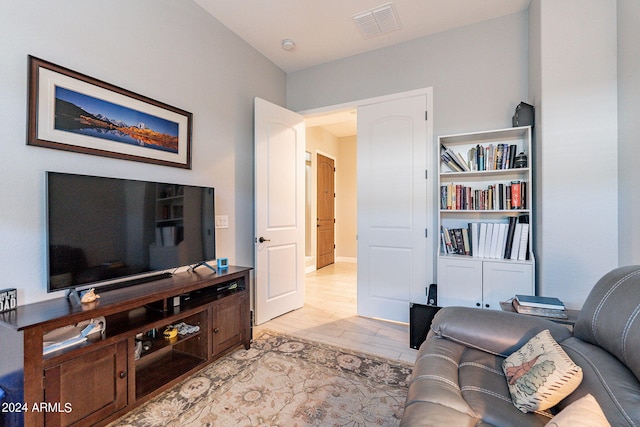 living room with light hardwood / wood-style flooring