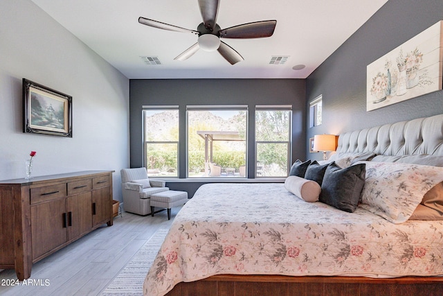 bedroom with ceiling fan and light wood-type flooring