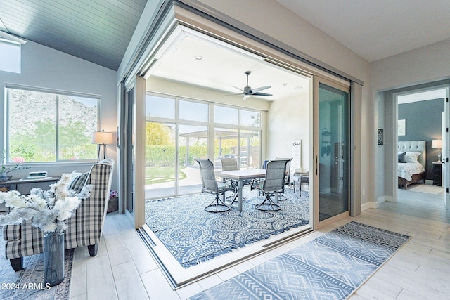 dining area featuring ceiling fan and vaulted ceiling