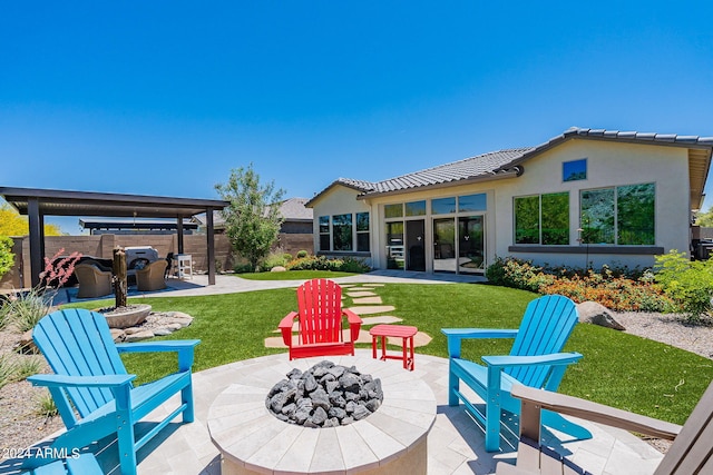 view of patio featuring an outdoor fire pit