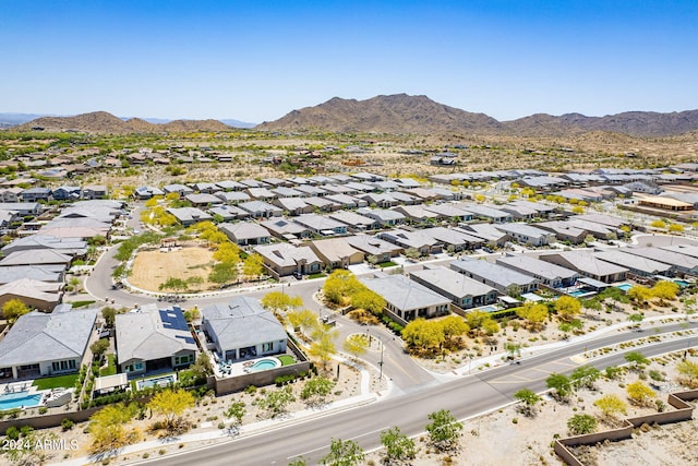 birds eye view of property featuring a mountain view