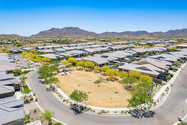 birds eye view of property with a mountain view