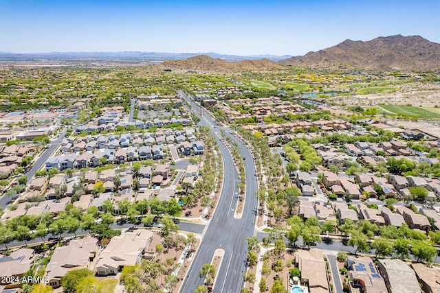 birds eye view of property with a mountain view