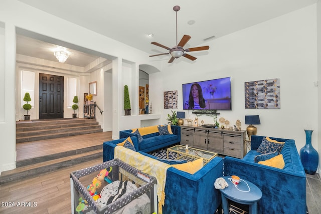 living room featuring ceiling fan and wood-type flooring