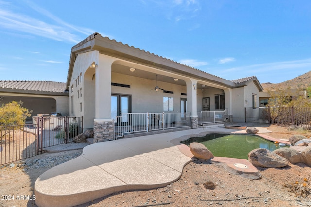 exterior space with a patio area and a fenced in pool