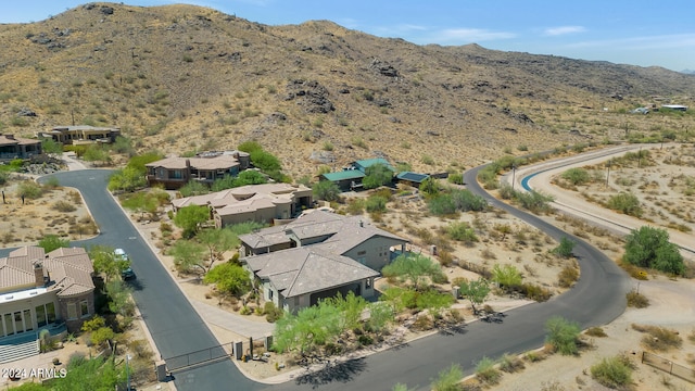 birds eye view of property featuring a mountain view