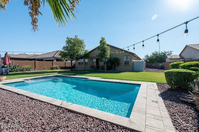 view of pool featuring a yard, a fenced backyard, and a fenced in pool