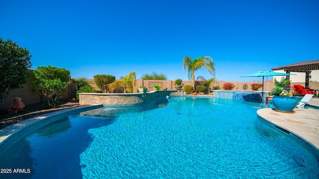 view of pool with a patio, a fenced backyard, and a pool with connected hot tub