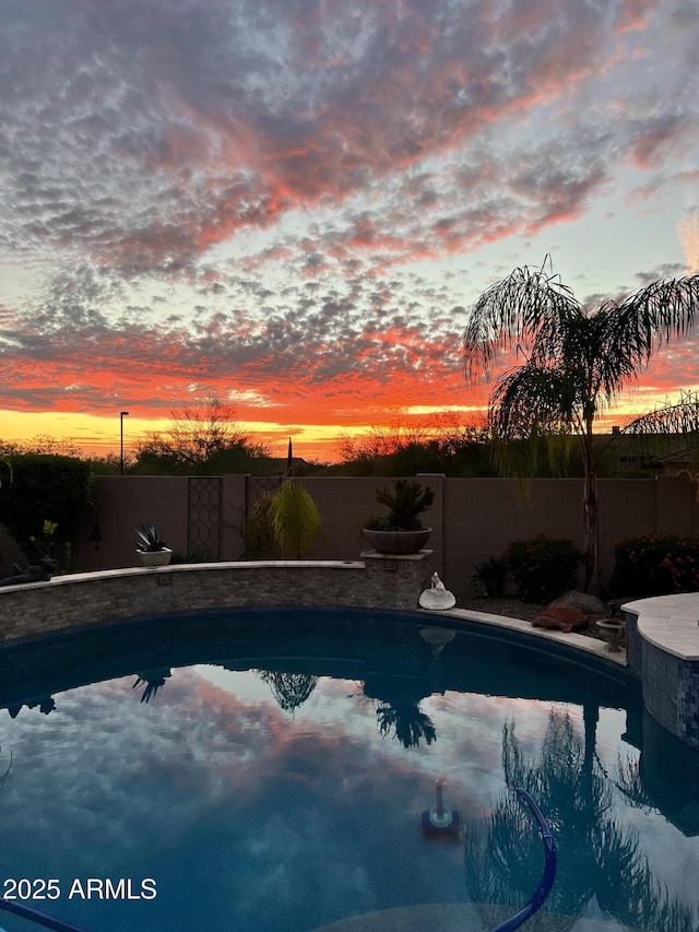 view of swimming pool featuring a fenced in pool and a fenced backyard