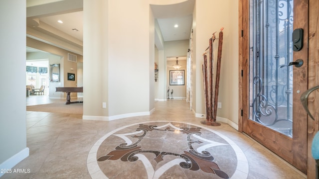 entryway with marble finish floor, recessed lighting, visible vents, and baseboards