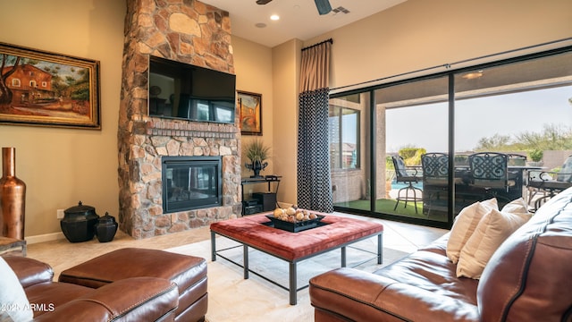 tiled living area featuring recessed lighting, visible vents, ceiling fan, a stone fireplace, and baseboards