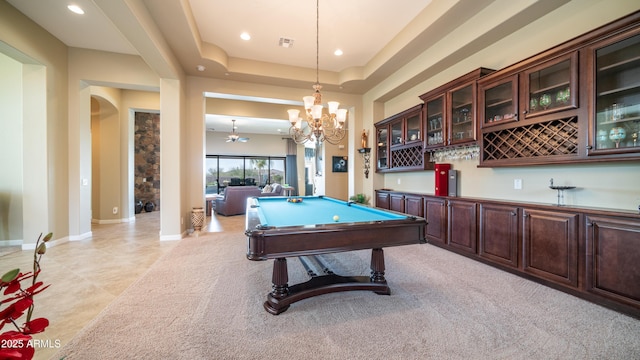 playroom with baseboards, arched walkways, a raised ceiling, and recessed lighting