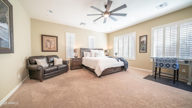 bedroom featuring light colored carpet, visible vents, baseboards, and recessed lighting