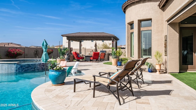 view of swimming pool with a patio area, a fenced backyard, and a pool with connected hot tub