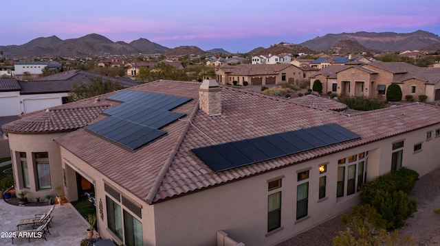 drone / aerial view with a residential view and a mountain view