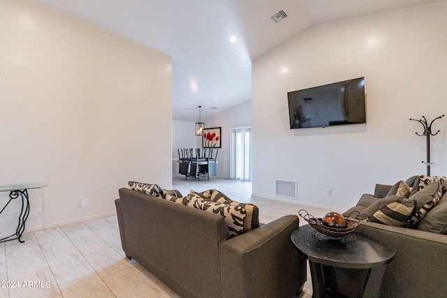 living room featuring vaulted ceiling