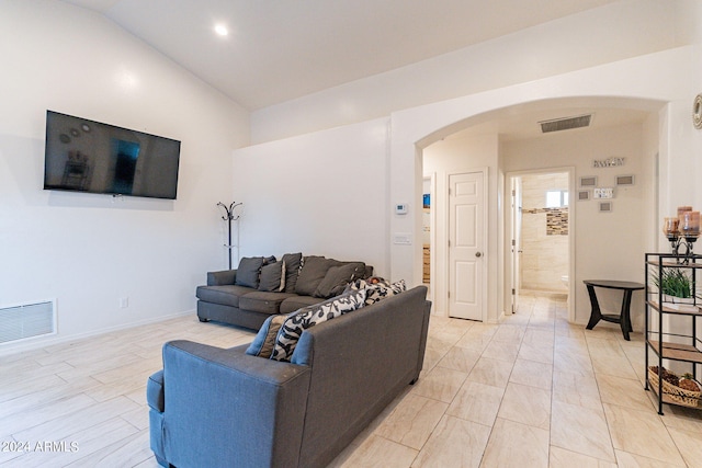 living room with lofted ceiling