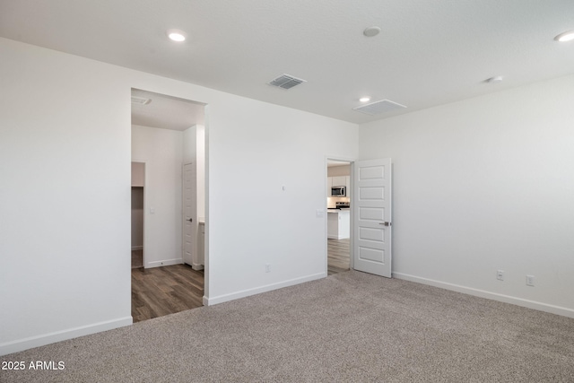 17848 W Mission Ln, Waddell, AZ 85355 - carpeted spare room featuring baseboards and recessed lighting