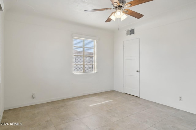 spare room with light tile patterned floors and ceiling fan