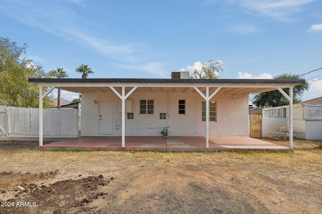 back of property with a patio area