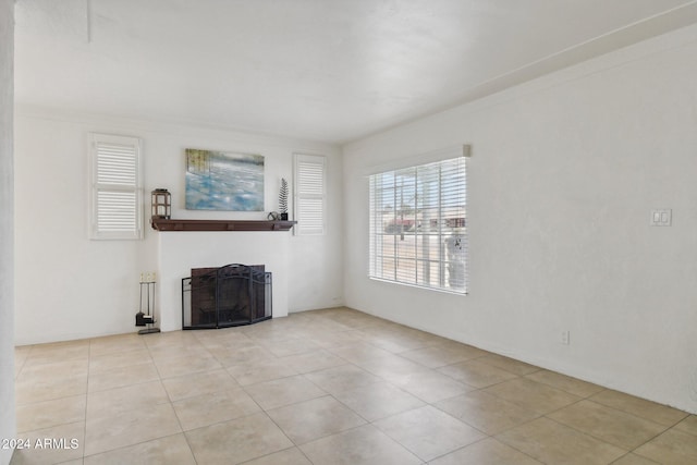 unfurnished living room featuring light tile patterned flooring