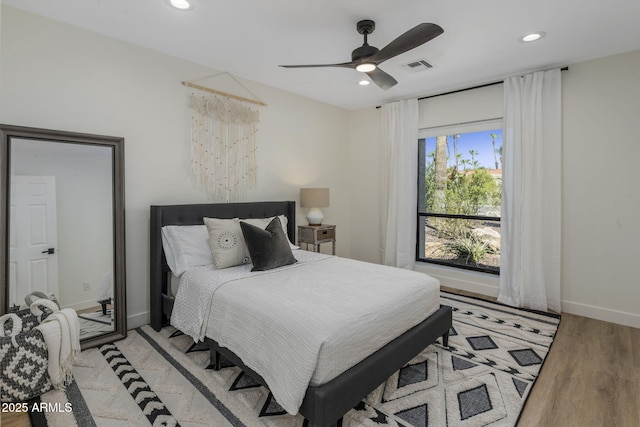 bedroom with recessed lighting, visible vents, ceiling fan, light wood-type flooring, and baseboards