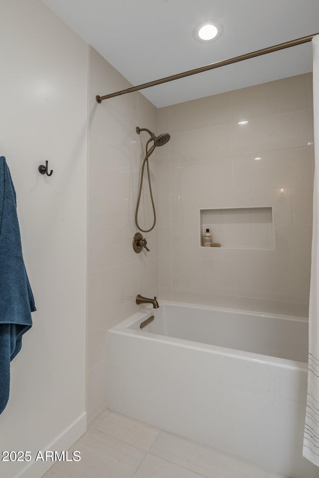 bathroom with shower / tub combo and tile patterned floors