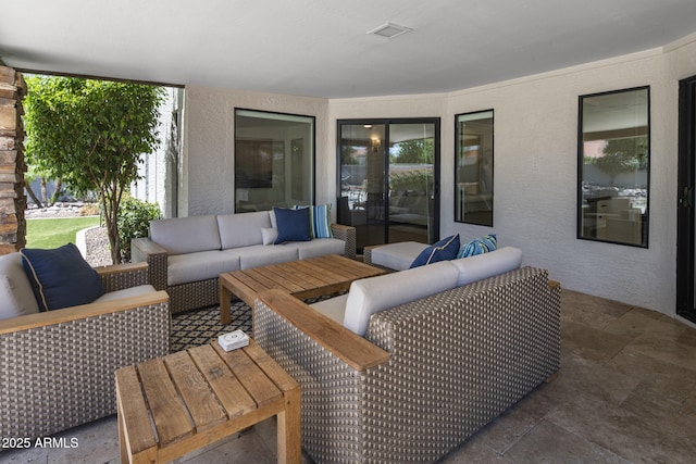 view of patio featuring visible vents and outdoor lounge area